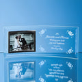 Engraved bevelled glass crescent frame with wedding photo and message on blue background.