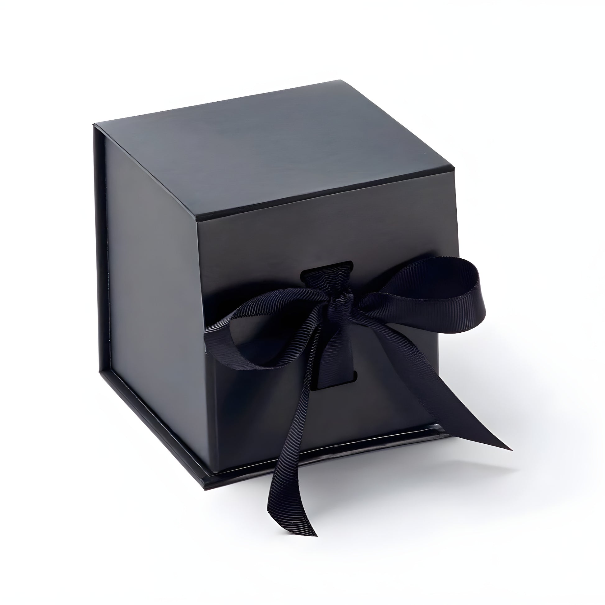 Black cube gift box with ribbon tied elegantly for luxury packaging