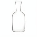 Clear glass water carafe with narrow neck and round base.