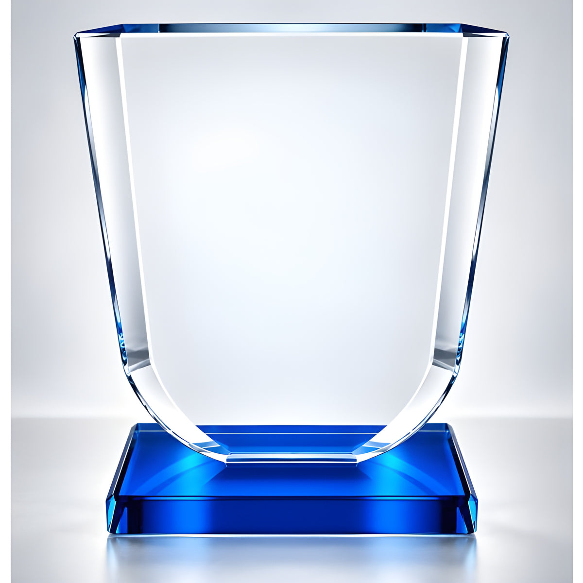 Elegant clear glass award plaque with blue base, 13.5 cm tall.