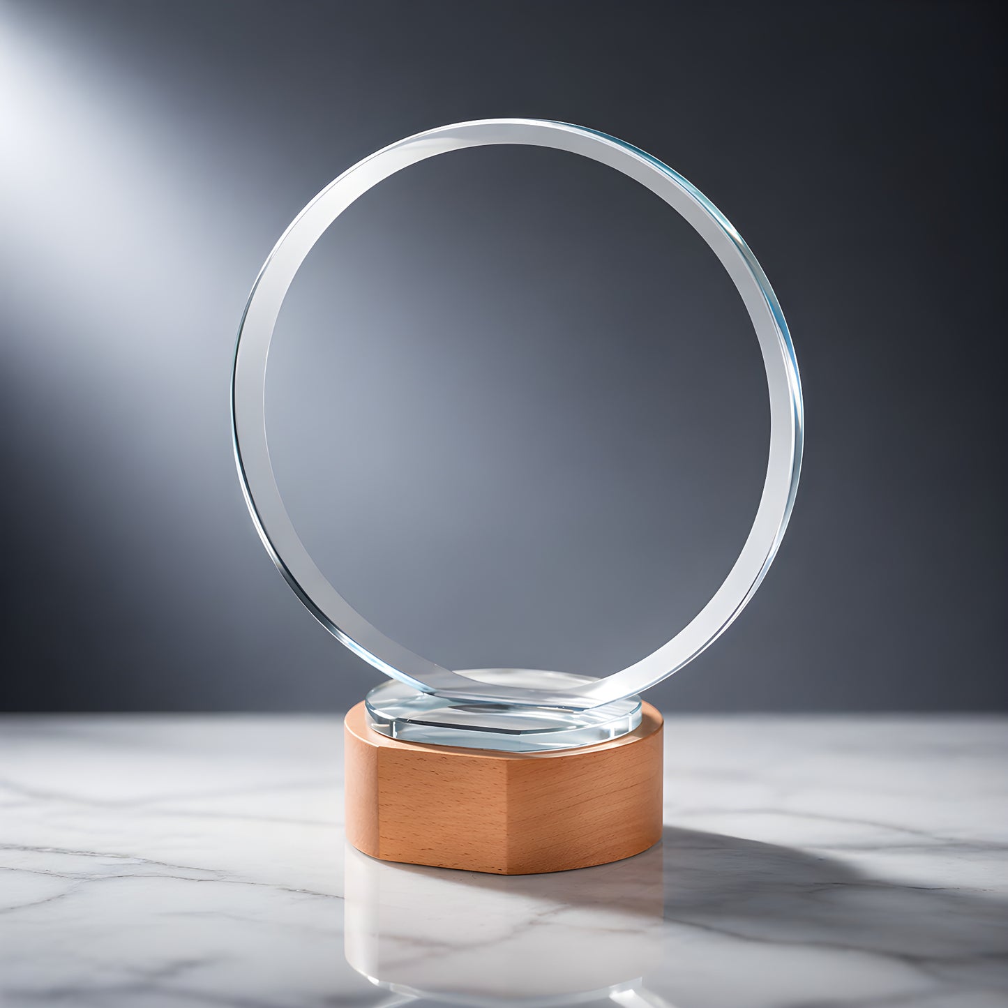 Elegant glass award on wooden base on marble surface
