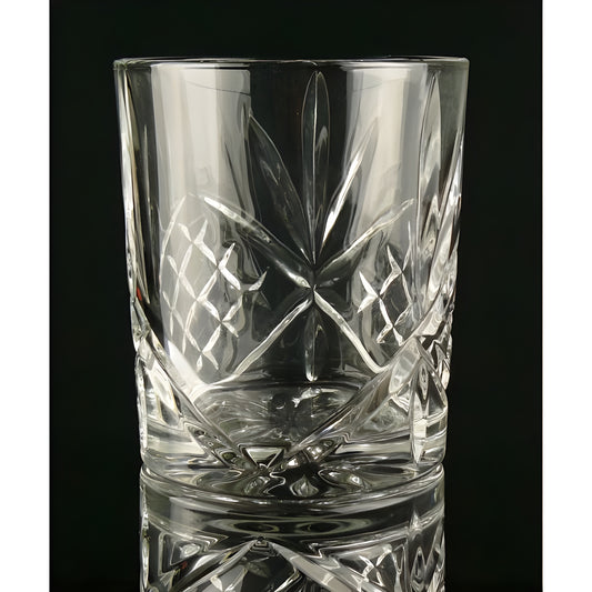 Crystal clear dublin cut whisky glass with patterned design.