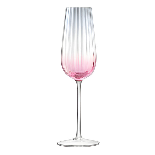 Pink ombre champagne flute with elegant ribbed design.