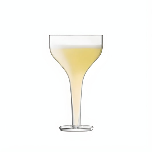 Modern cocktail in yellow liquid within a clear glass saucer on a white background.