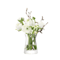White ranunculus flowers in a clear glass vase with branches.