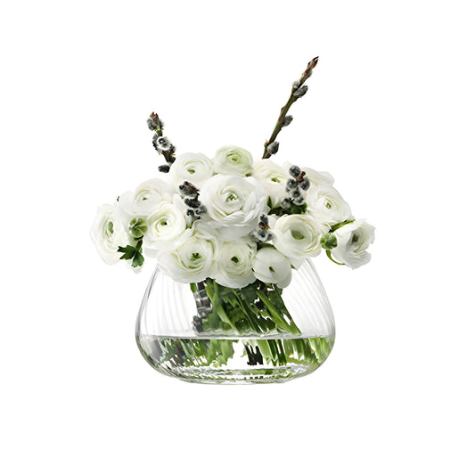 White ranunculus and pussy willow bouquet in a glass vase.