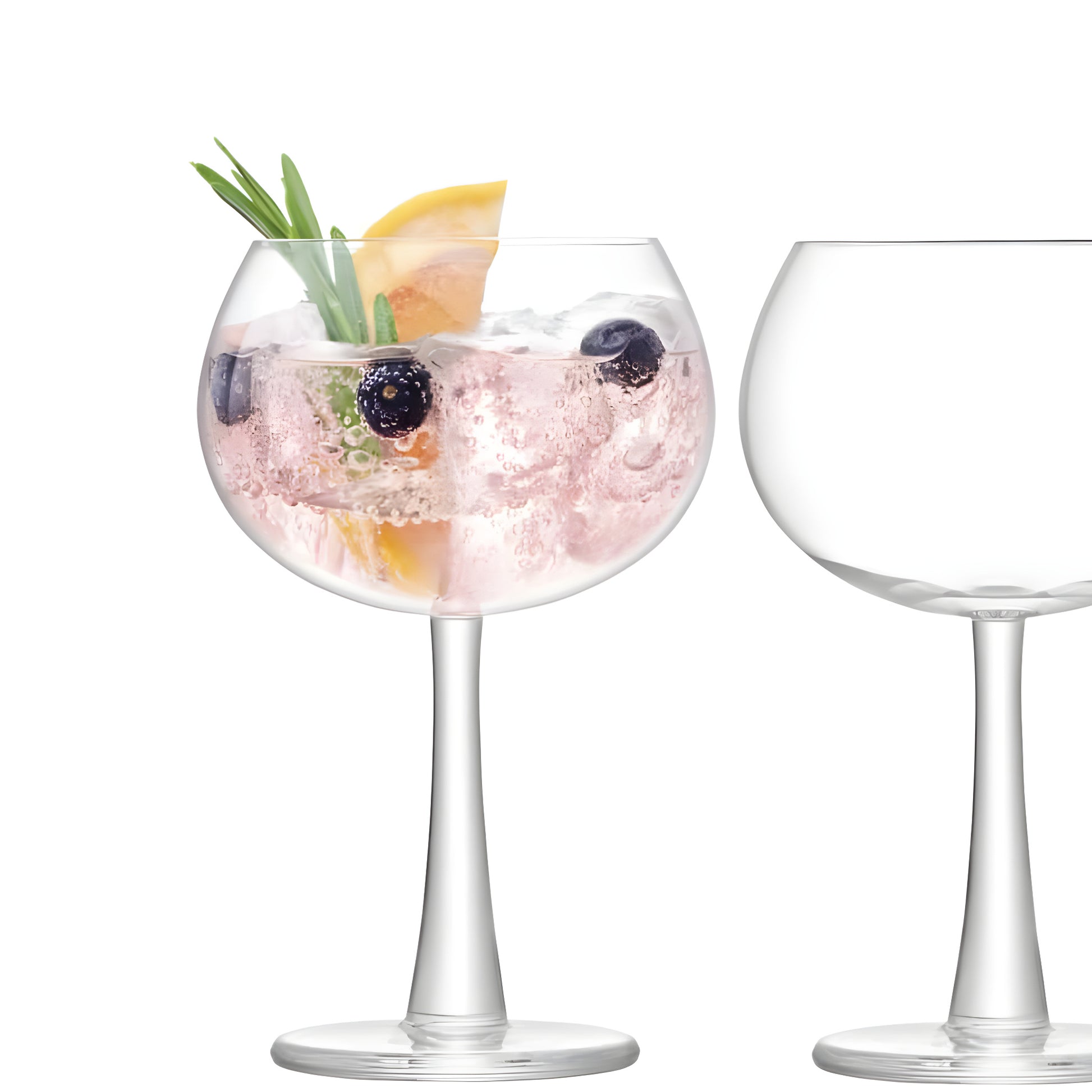 420ml gin glass with garnish and empty glass on white background