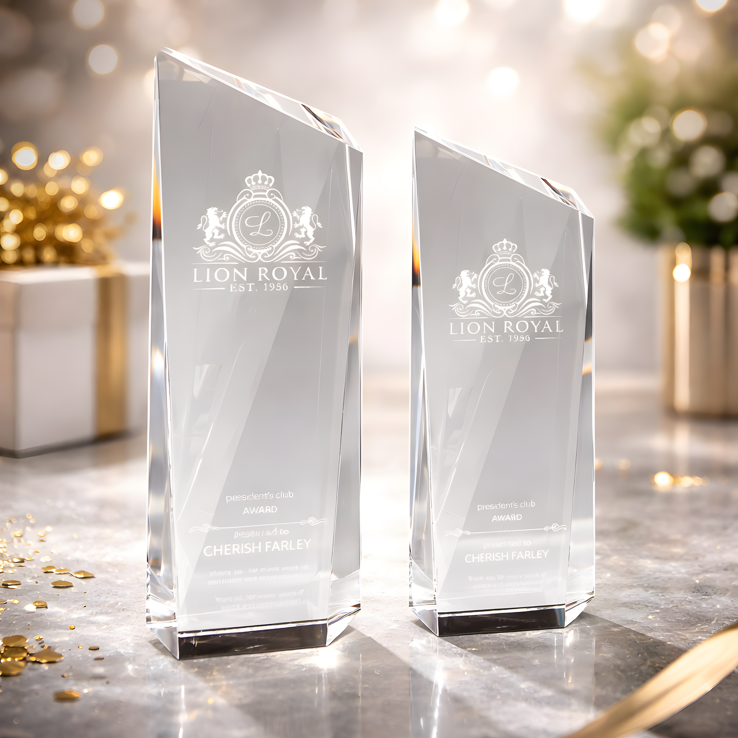 Clear glass trophies with engraved Lion Royal logo for President's Club award.