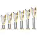 Set of silver and gold plastic trophies in different sizes with metallic cup design.