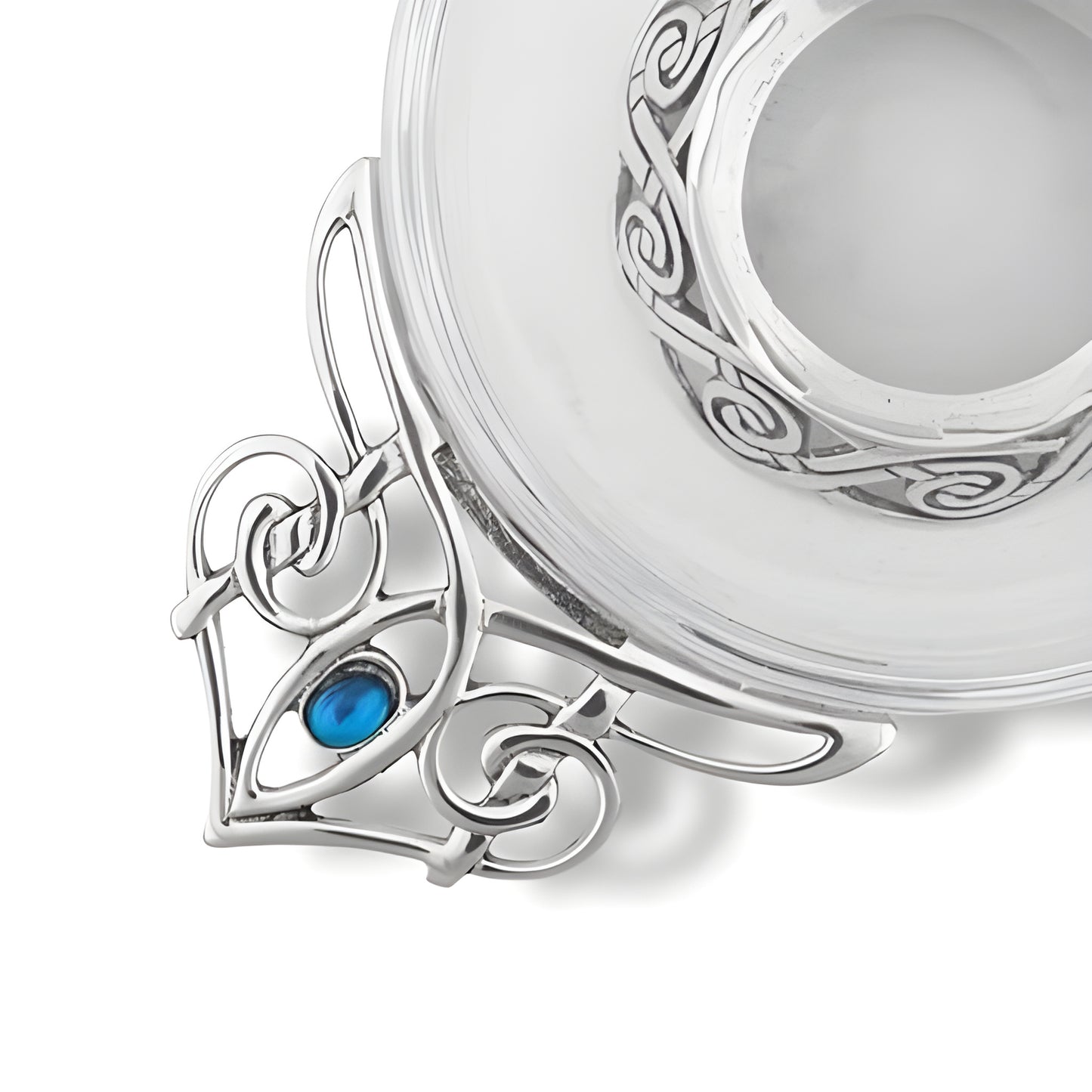 Celtic quaich bowl with ornate pewter and blue stone detailing.
