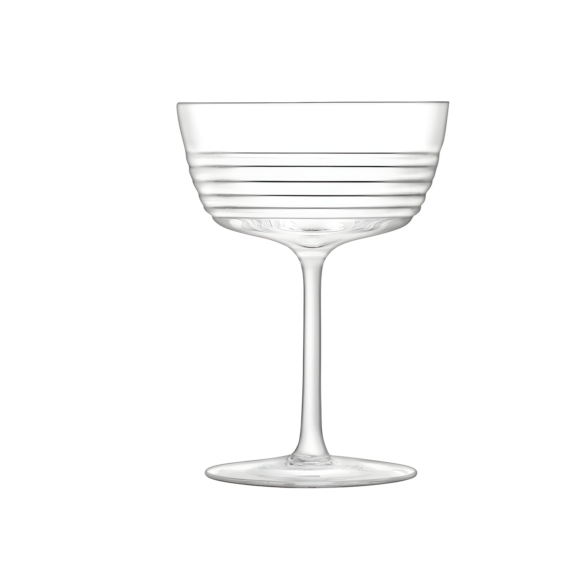 Elegant ribbed design groove glass champagne saucer on white background
