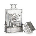 Elegant glass decanter with silver Irish harp and clover accents.