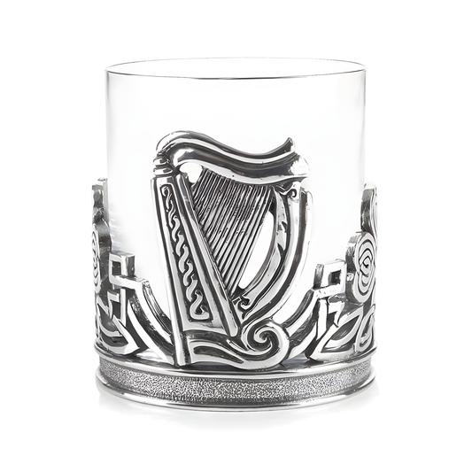 Glass whiskey tumbler with pewter Irish harp and shamrock design
