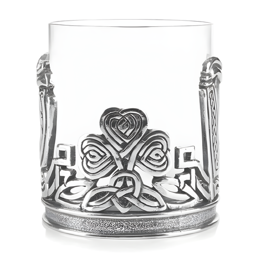 Decorative whiskey tumbler with Celtic claddagh and shamrock design in pewter.