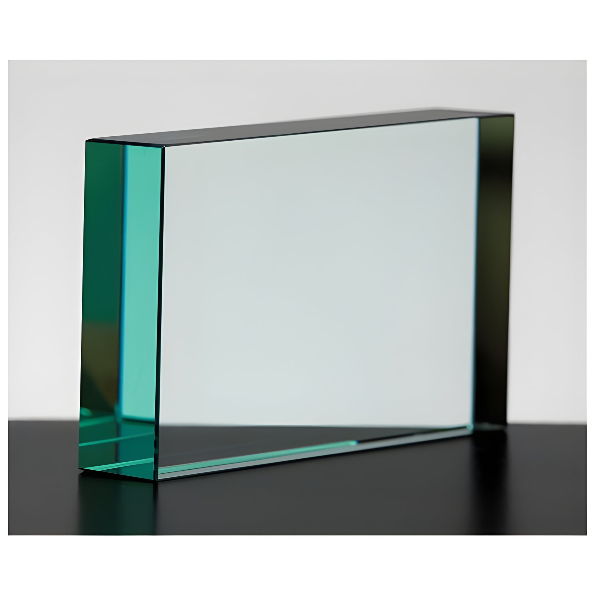 Rectangular jade glass award block on black surface