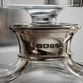 Close-up of a crystal bourbon decanter with hallmarks on the neck.