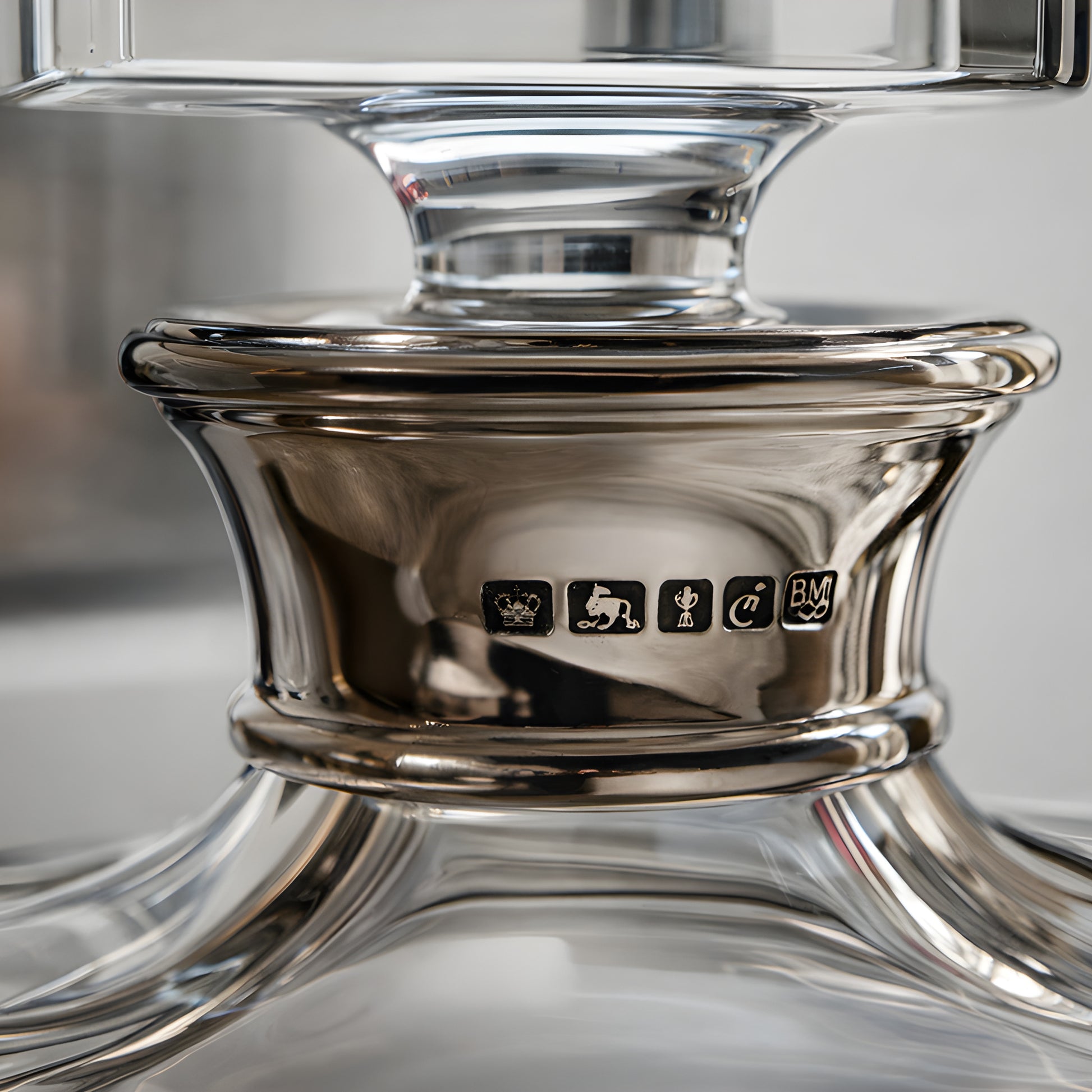 Close-up of a crystal bourbon decanter with hallmarks on the neck.