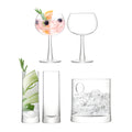 Glassware set with ice bucket and cocktail glasses for gin and tonic preparation.