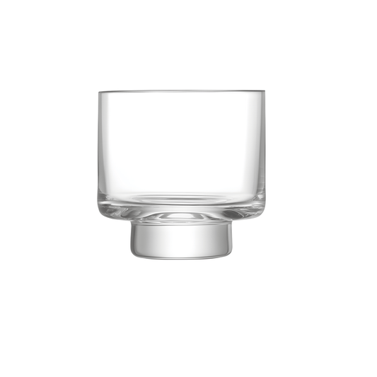 Clear modern whisky glass with unique base design on white background.