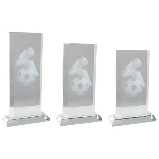 Three crystal awards with engraved soccer shoes and ball motif.