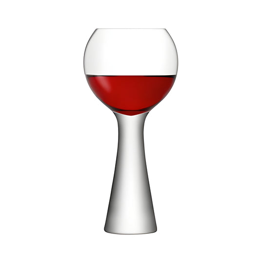 Modern balloon glass filled with red wine against white background.