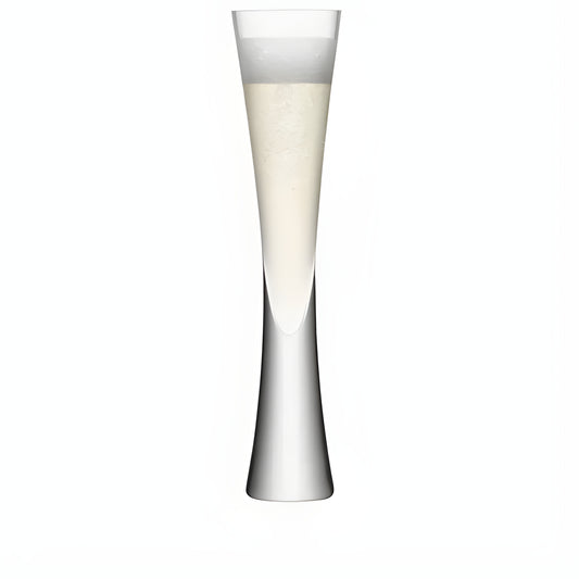 Tall modern champagne flute with sleek design filled with bubbly champagne.