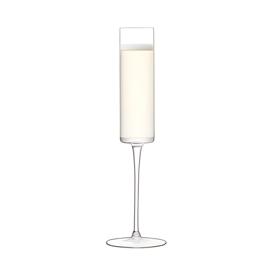 Crystal-clear champagne flute with bubbling champagne.