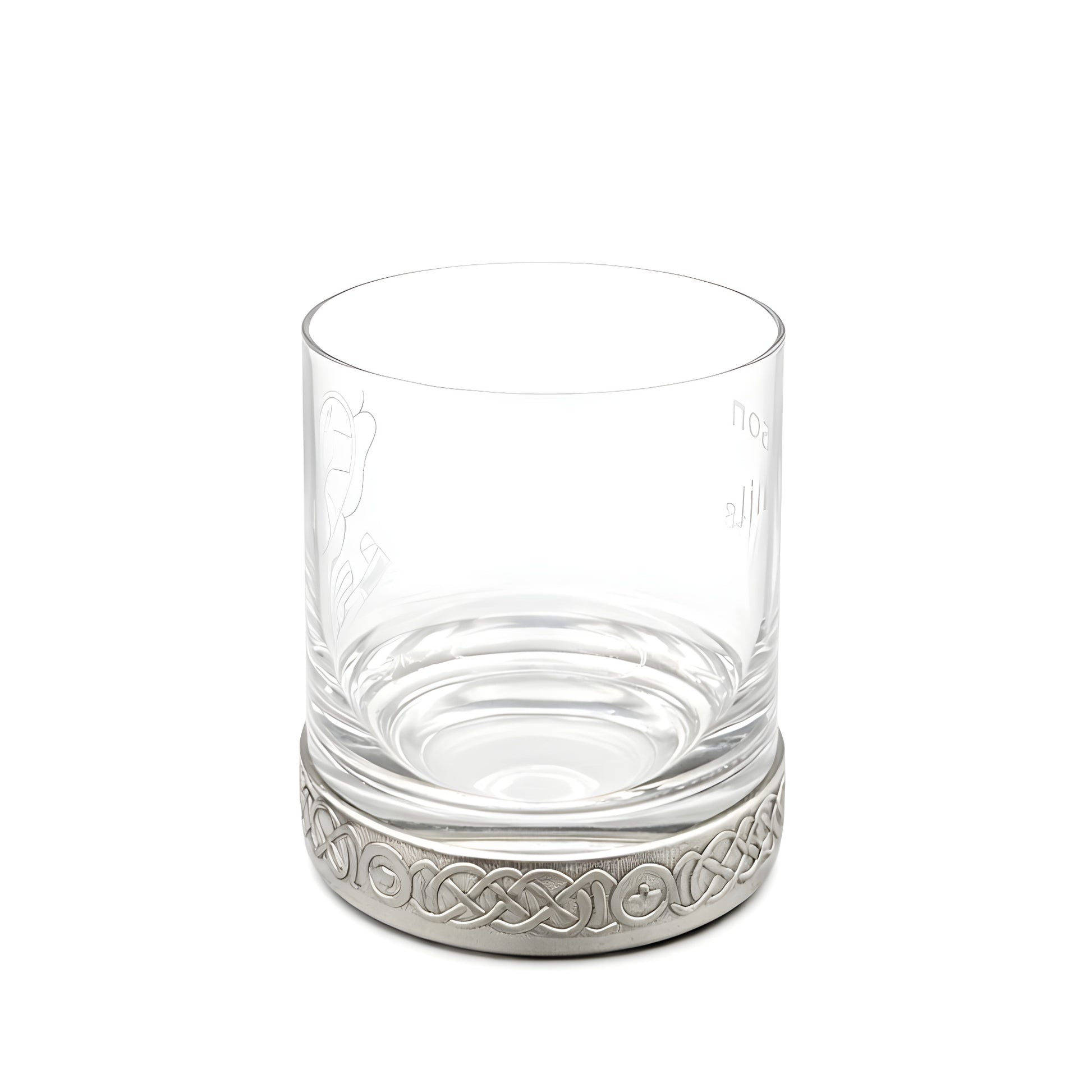 Clear whisky glass with a decorative pewter base featuring a Celtic pattern.