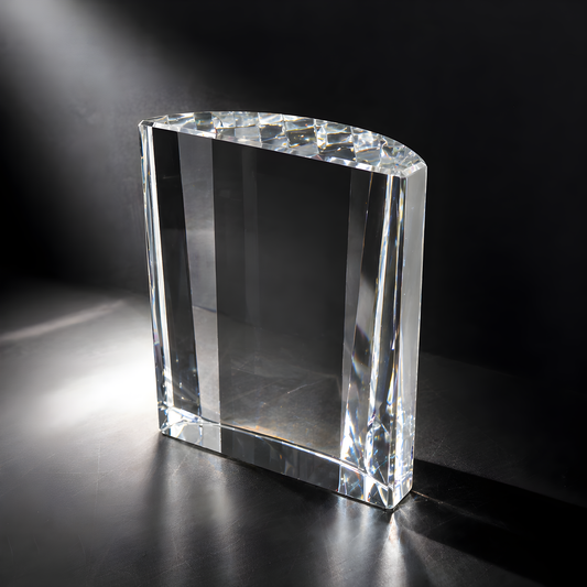 Rectangular scallop optic glass award on a black surface.