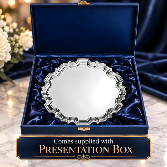 Silver-plated Chippendale salver in a blue presentation box on marble surface.