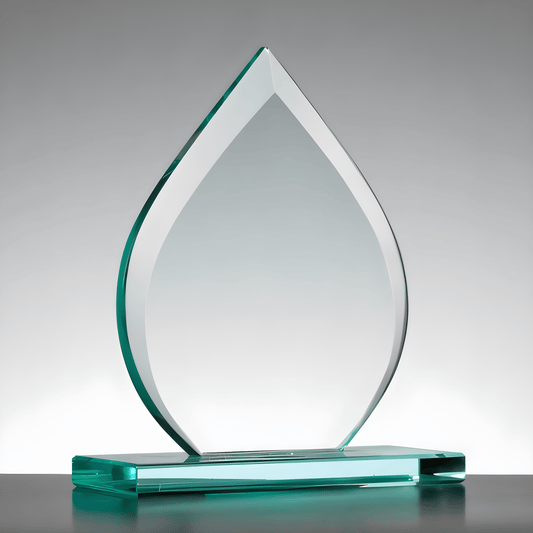 Clear glass teardrop-shaped award trophy on a base.