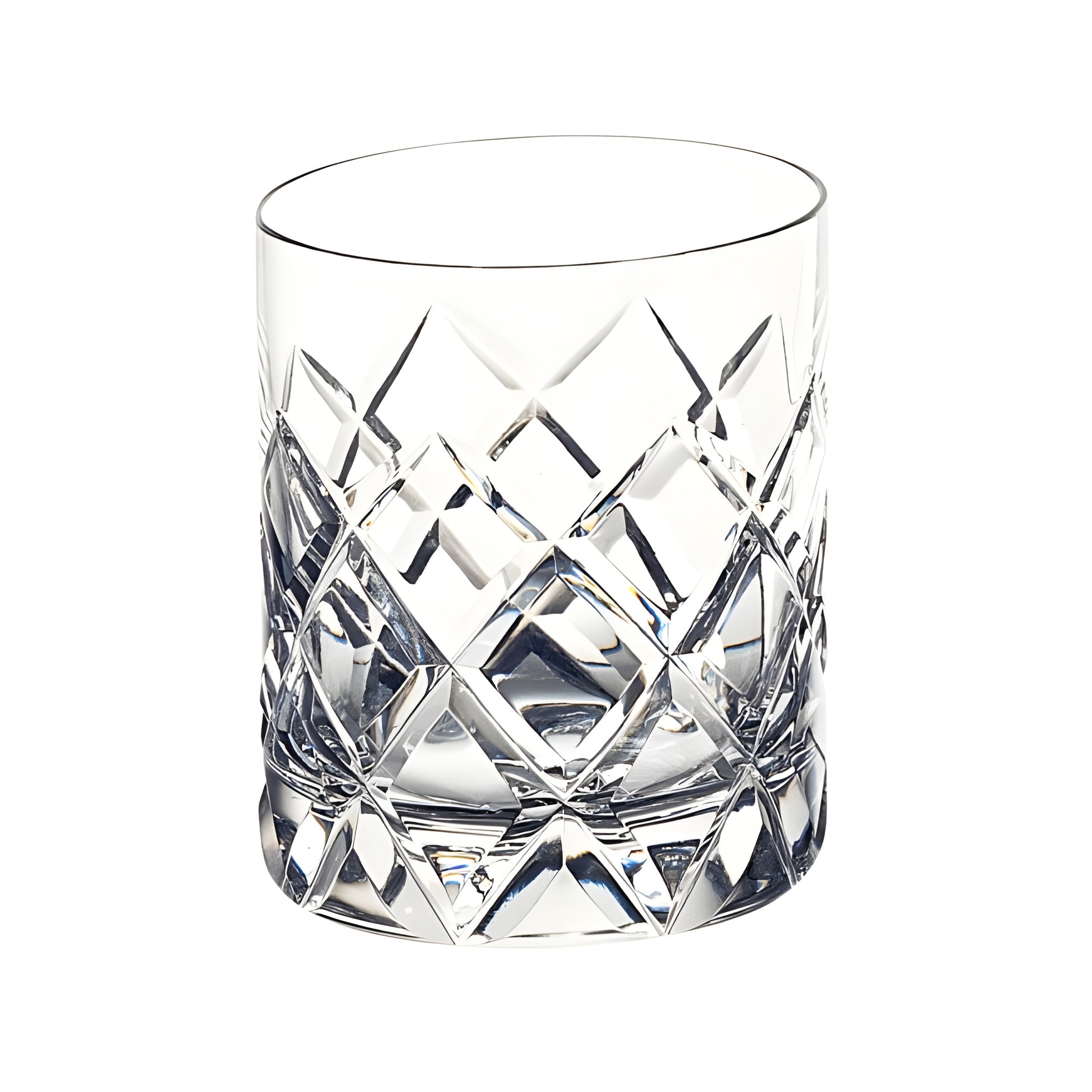 Crystal whiskey glass with diamond cut design.
