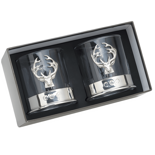 Pair of whisky glasses with silver stag head design in gift box.