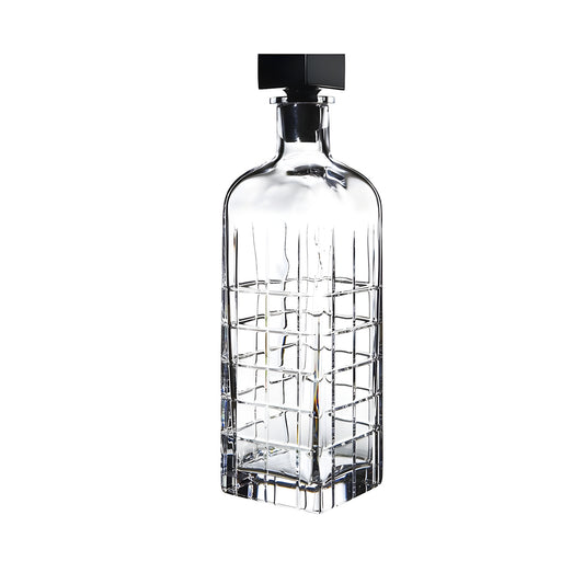 Square crystal whiskey decanter with black stopper.