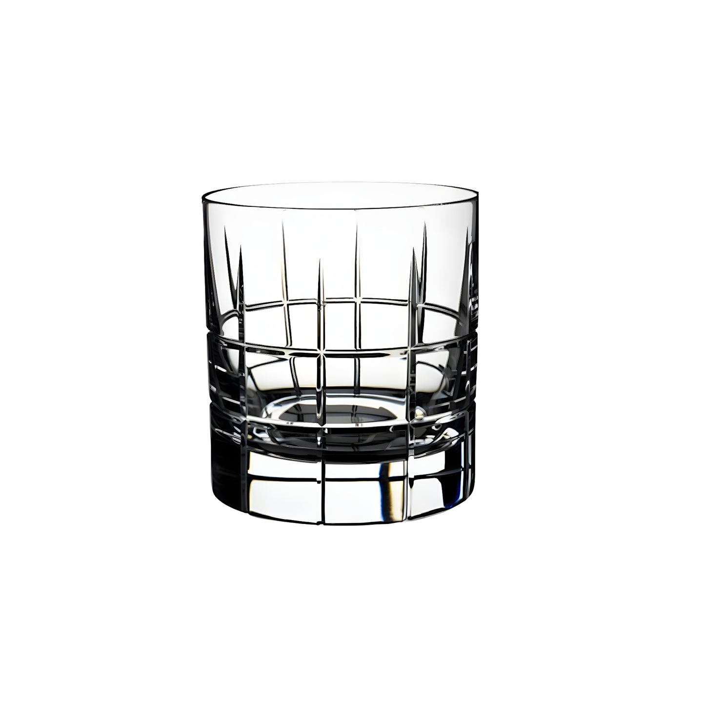 Cut crystal whiskey glass with geometric pattern against white background.