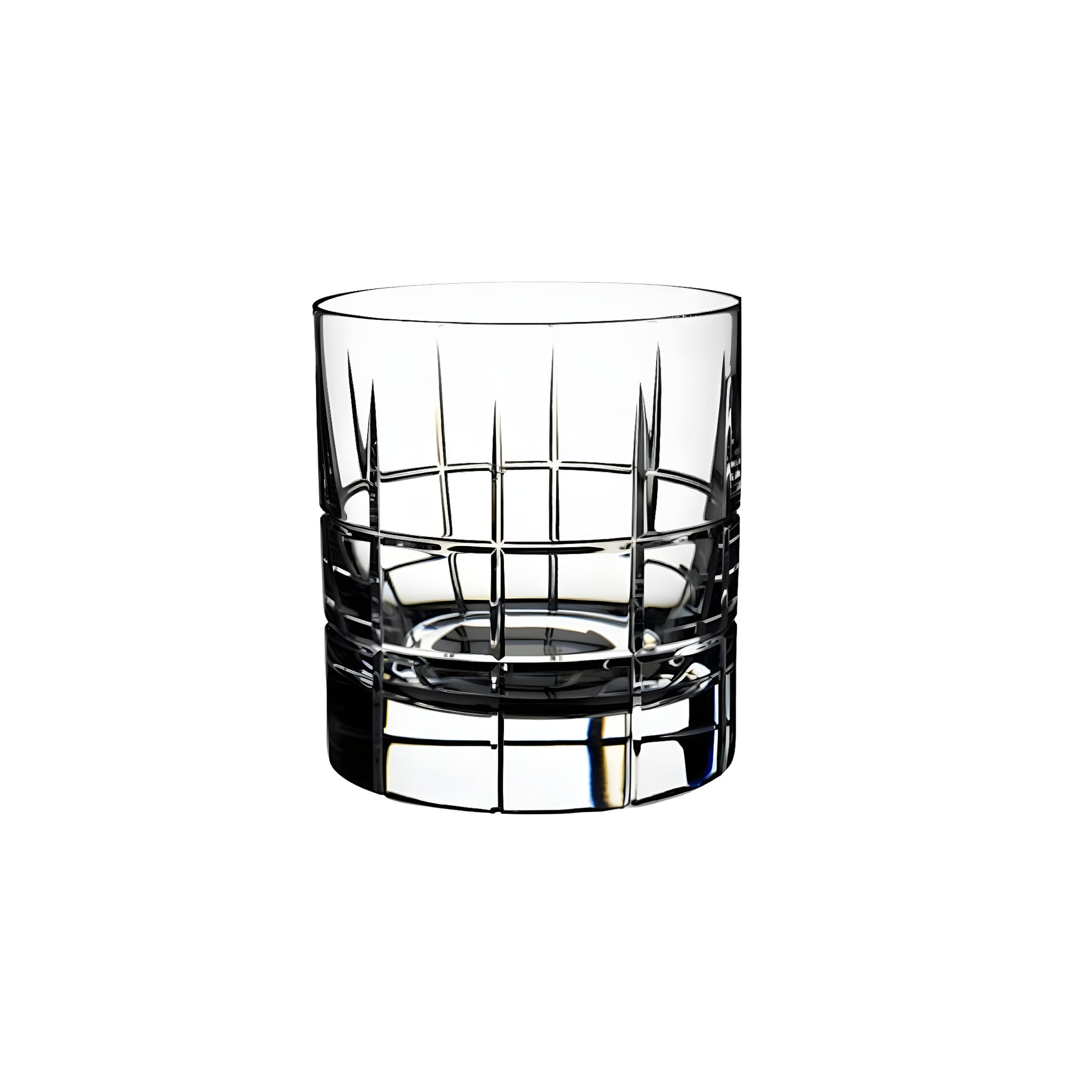 Cut crystal whiskey glass with geometric pattern against white background.
