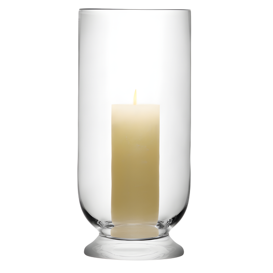 Glass hurricane lantern with lit pillar candle for minimalist decor.