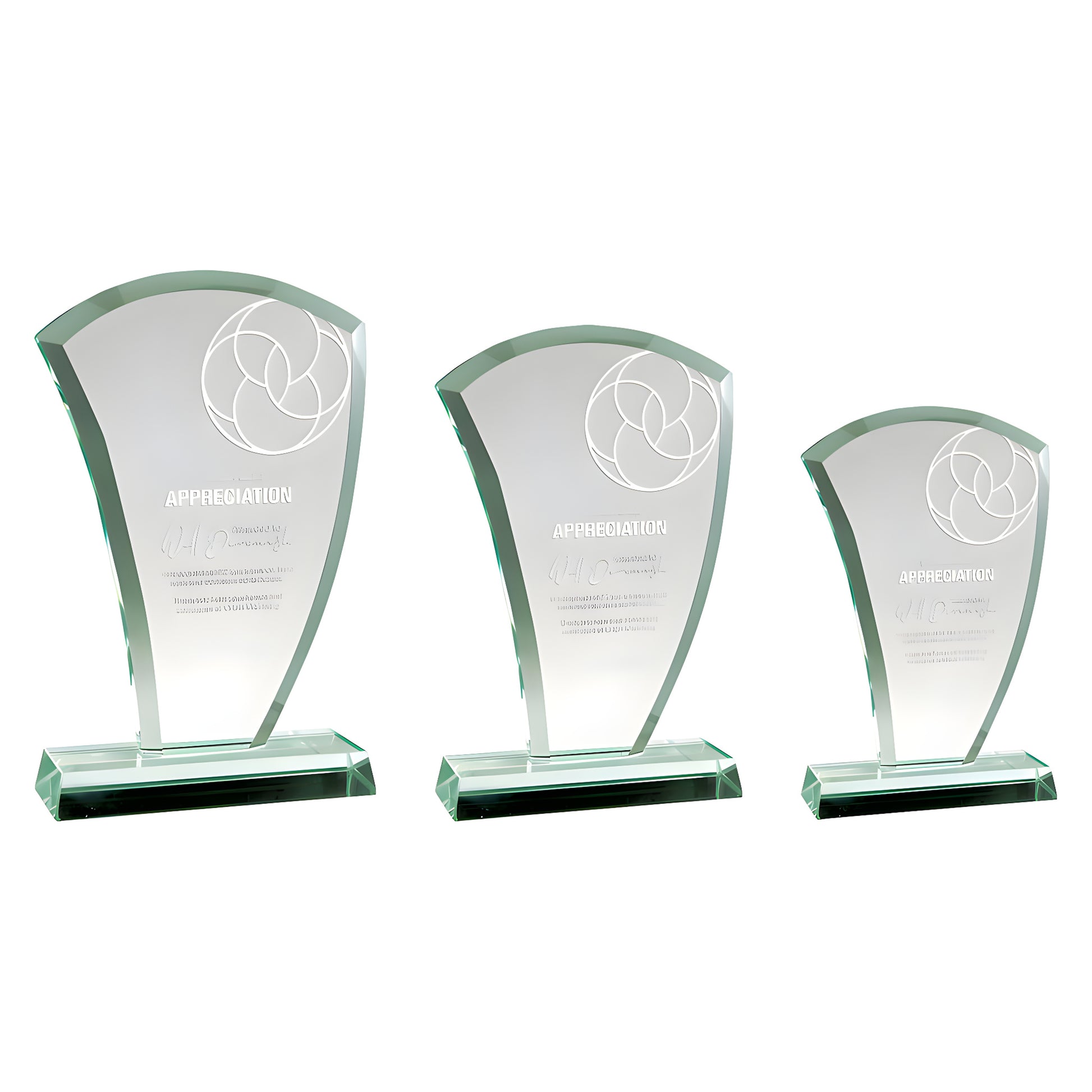 Three jade glass appreciation awards with engraved design on white background.