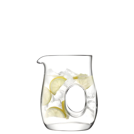 Hand-blown glass pitcher with lemon slices and ice, featuring a unique handle design.