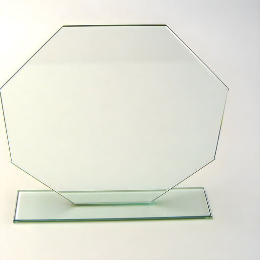 Octagonal glass award trophy with base on white background.