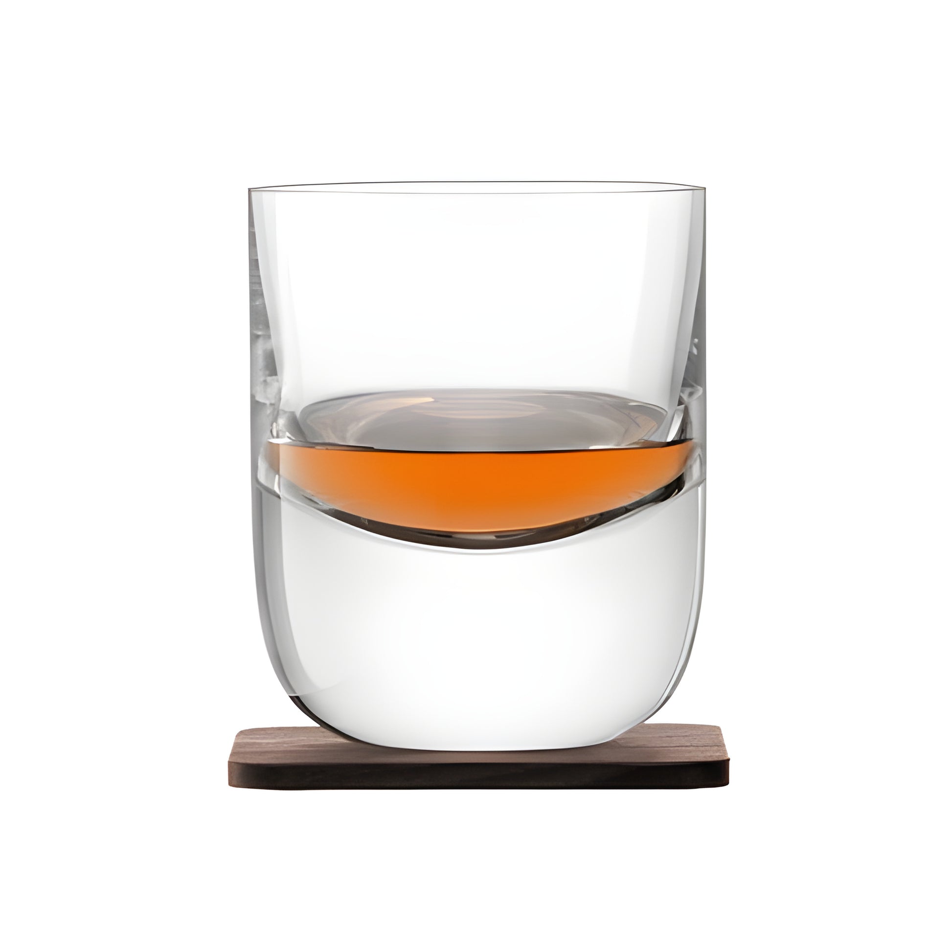Modern crystal whisky tumbler with wood coaster, partially filled.
